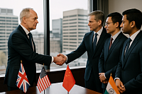 A senior British diplomat in a navy suit shakes hands with an American counterpart in a modern office setting, with representatives from China and India observing. Small flags of the UK, USA, China, and India are placed on a conference table, symbolizing strategic diplomacy, trade cooperation, and Britain’s role as an independent middle power engaging with global partners.